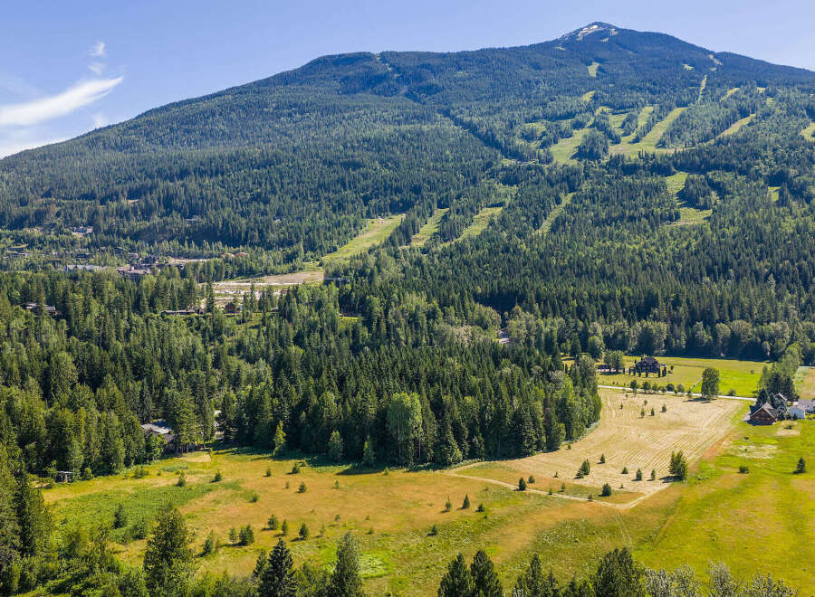 Nestled amidst a lush, green landscape, this property offers a serene mountain retreat with stunning views.