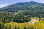 Nestled amidst a lush, green landscape, this property offers a serene mountain retreat with stunning views.