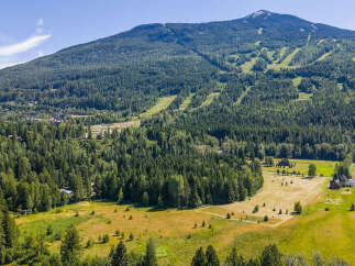 Nestled amidst a lush, green landscape, this property offers a serene mountain retreat with stunning views.