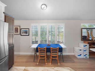 This dining area features a bright and airy atmosphere, perfect for casual meals.