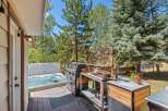Enjoy ultimate relaxation and entertainment in this backyard oasis, featuring a bubbling hot tub perfect for unwinding and a spacious deck ideal for hosting.