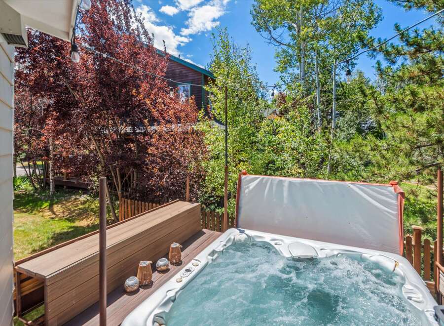 Relax and unwind in this luxurious hot tub, perfect for soaking up the mountain views.