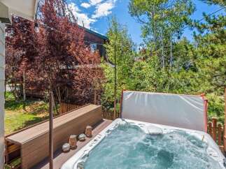 Relax and unwind in this luxurious hot tub, perfect for soaking up the mountain views.
