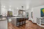 Experience modern living in this stunning kitchen, featuring a large island with seating perfect for casual dining and entertaining.