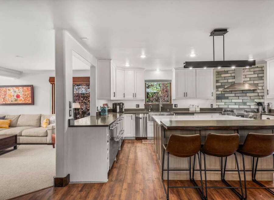 Experience the best of open-concept living with this stunning kitchen and adjacent living area.