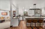 Experience the best of open-concept living with this stunning kitchen and adjacent living area.