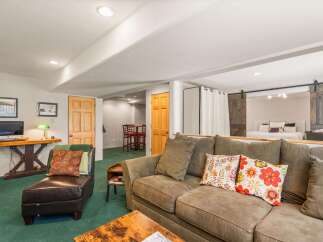 Discover comfortable living in this versatile space, featuring a plush sectional sofa perfect for relaxation and a stylish chaise lounge.