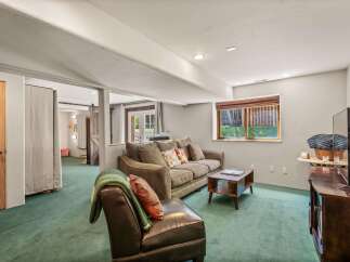 Discover this inviting basement living area, perfect for relaxation and entertainment.