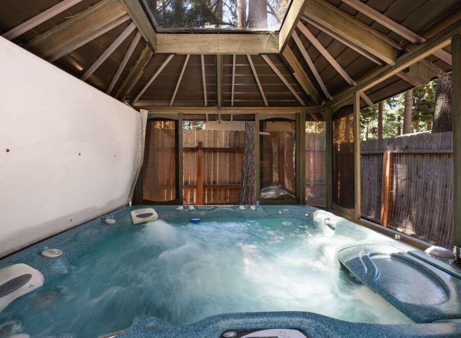 Indulge in ultimate relaxation in this luxurious outdoor hot tub, perfect for unwinding after a long day.