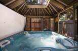 Indulge in ultimate relaxation in this luxurious outdoor hot tub, perfect for unwinding after a long day.