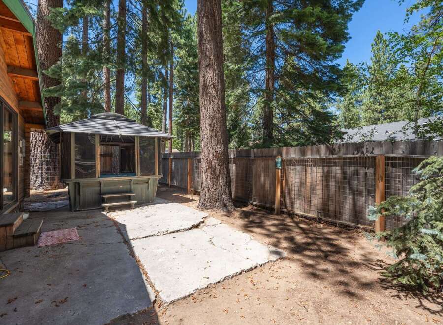 Escape to this charming backyard oasis, perfect for relaxation and entertaining.