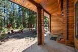 Experience rustic charm with this inviting cabin nestled amongst tall pine trees.