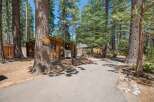 Discover your perfect getaway at Knotty Pine Cabin, a charming rustic retreat nestled among tall pine trees.