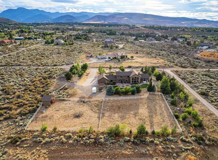 Discover this expansive estate featuring a luxurious home with stunning architectural details and ample living space.