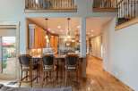 Experience luxury living in this stunning home featuring a gourmet kitchen with rich wood cabinetry and granite countertops, perfect for entertaining.