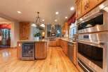 Experience luxury in this stunning kitchen featuring custom wood cabinetry and granite countertops.