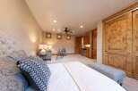 Experience rustic charm and modern comfort in this beautifully appointed bedroom.