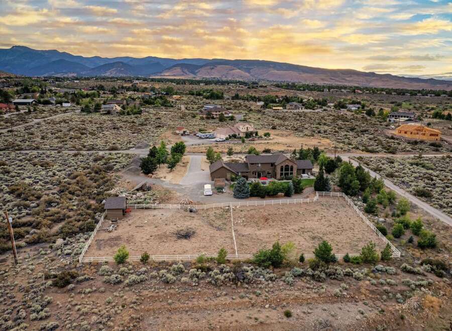 Discover this expansive property featuring a spacious home with a large fenced yard, perfect for animals or outdoor activities.