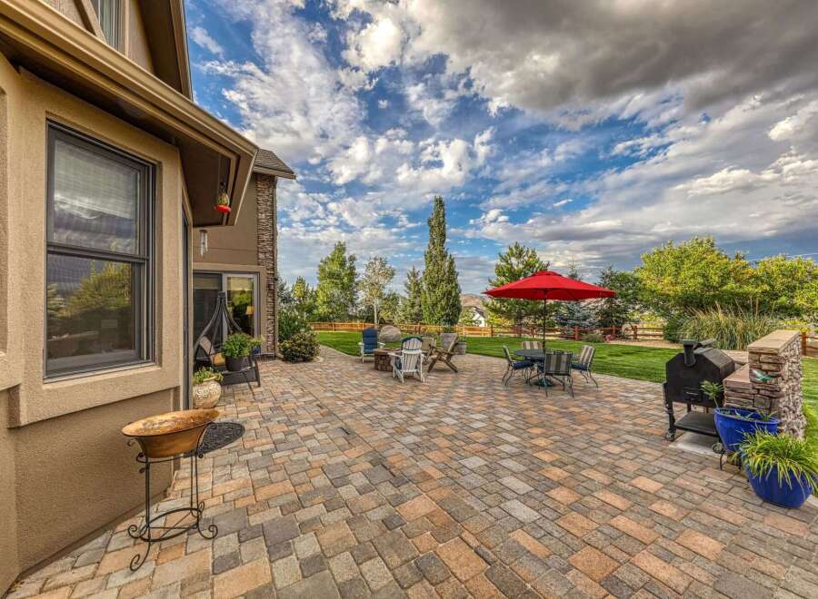 Enjoy outdoor living at its finest on this expansive paver patio, perfect for entertaining.