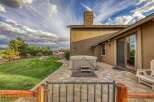 Enjoy outdoor living with this spacious backyard featuring a luxurious hot tub perfect for relaxation.