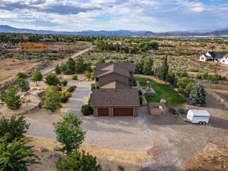 Discover this stunning property offering breathtaking panoramic views of the surrounding mountains and valley.