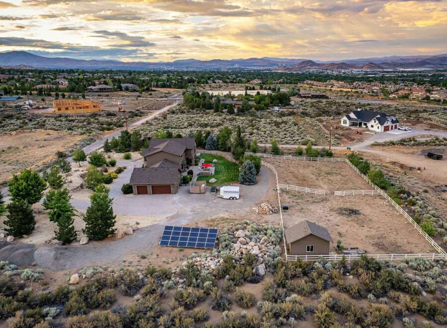 Discover this stunning property featuring a spacious home with a three-car garage, perfect for car enthusiasts or extra storage.