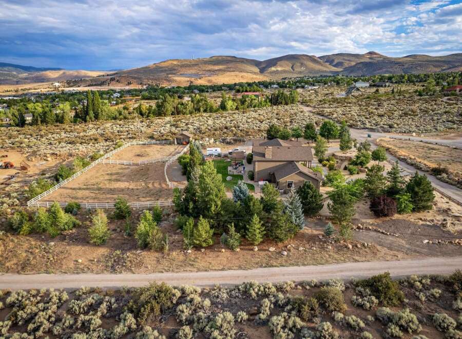 Discover this stunning property featuring a spacious home with a large fenced arena, perfect for equestrian enthusiasts.