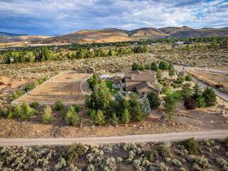 Discover this stunning property featuring a spacious home with a large fenced arena, perfect for equestrian enthusiasts.