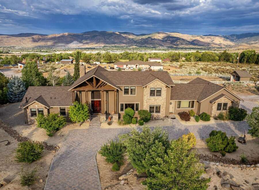 Discover this stunning custom-built estate offering breathtaking mountain views and unparalleled privacy.