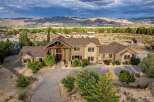 Discover this stunning custom-built estate offering breathtaking mountain views and unparalleled privacy.