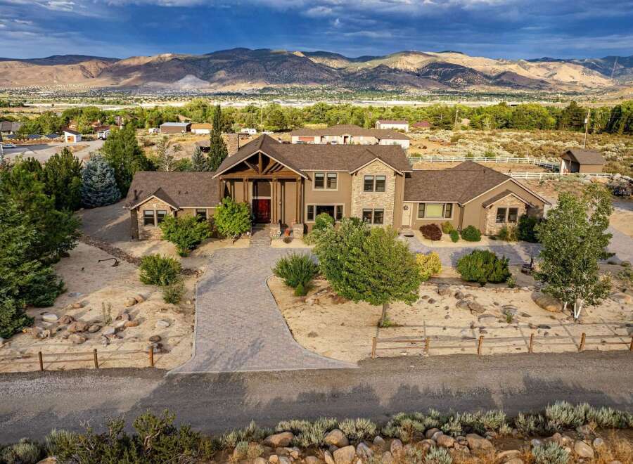 Discover this stunning custom-built home offering breathtaking mountain views and a serene desert landscape.