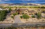Discover this stunning custom-built home offering breathtaking mountain views and a serene desert landscape.