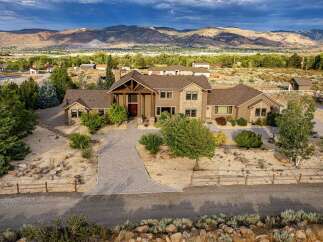 Discover this stunning custom-built home offering breathtaking mountain views and a serene desert landscape.