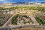 Discover this stunning custom-built estate nestled on a sprawling lot with breathtaking mountain views.