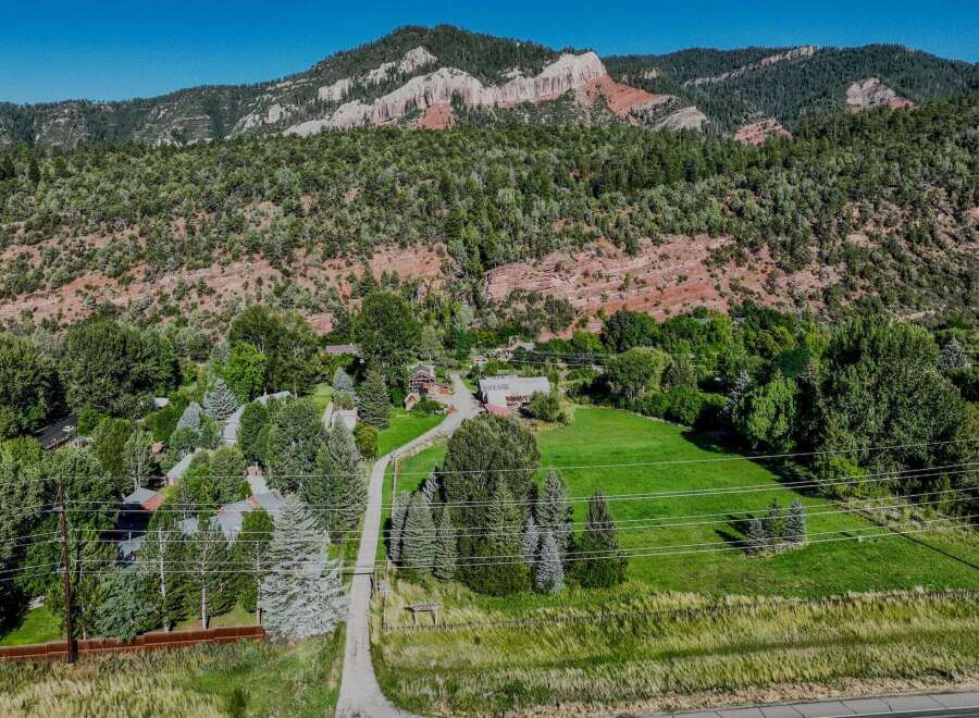 Nestled against a backdrop of majestic red rock mountains and lush green forests, this property offers a serene and private retreat.