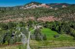 Nestled against a backdrop of majestic red rock mountains and lush green forests, this property offers a serene and private retreat.