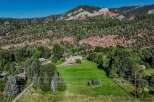 Nestled against a backdrop of majestic red rock mountains and lush green forests, this property offers a serene and private retreat.
