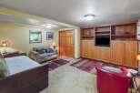 This cozy living area features a comfortable sofa and a daybed, perfect for relaxing or hosting guests.