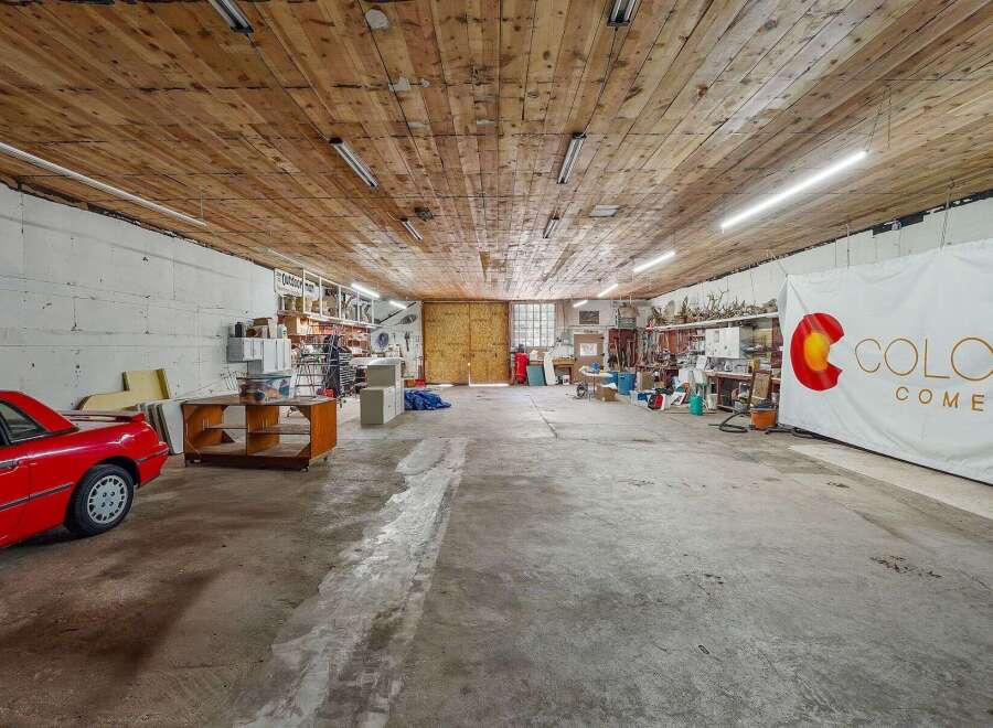 Discover a versatile workshop space with ample room for projects and storage.