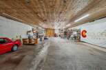 Discover a versatile workshop space with ample room for projects and storage.