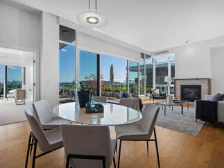 Experience luxurious urban living in this stunning condo featuring a spacious open-concept living and dining area.