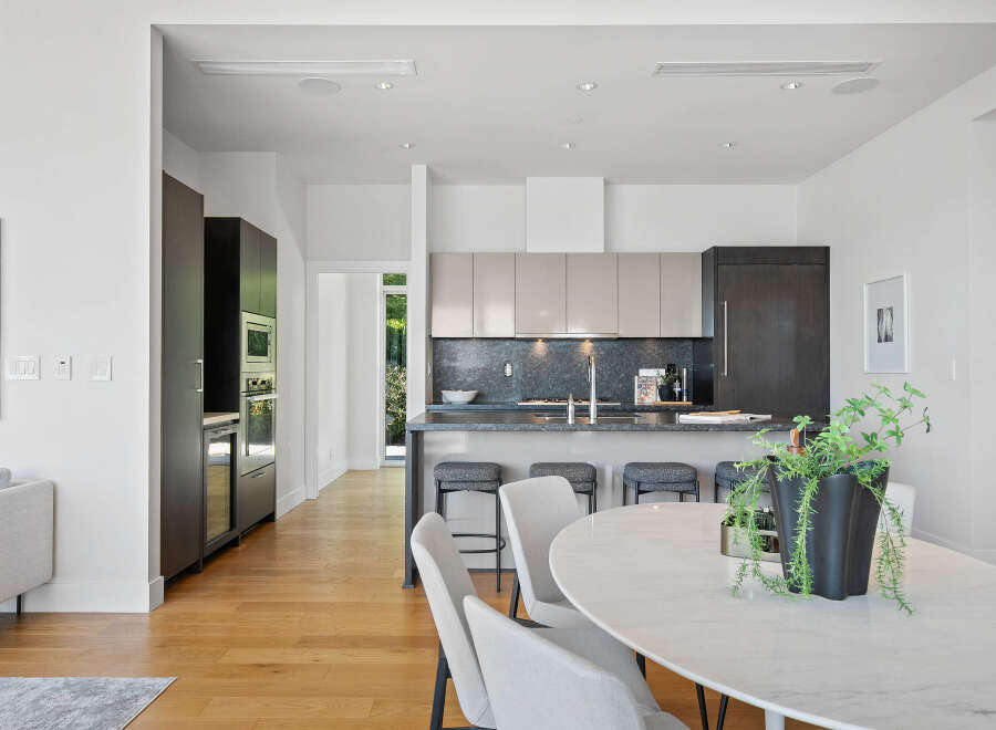 Experience modern luxury in this stunning open-concept kitchen and dining area.