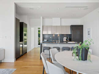 Experience modern luxury in this stunning open-concept kitchen and dining area.