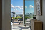 Experience breathtaking city views from this stunning apartment, featuring a spacious balcony perfect for entertaining.