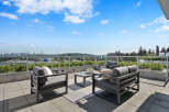 Enjoy breathtaking panoramic views from this stunning rooftop patio, perfect for entertaining or relaxing.