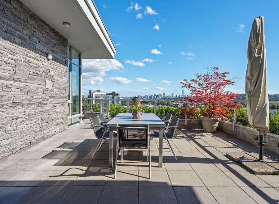 Enjoy breathtaking city and water views from this expansive private terrace, perfect for al fresco dining and entertaining.
