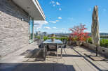 Enjoy breathtaking city and water views from this expansive private terrace, perfect for al fresco dining and entertaining.