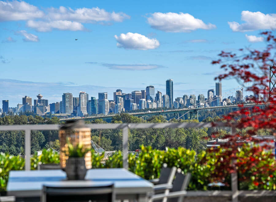Experience breathtaking panoramic views of the city skyline and Lions Gate Bridge from this stunning property.