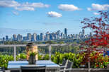 Experience breathtaking panoramic views of the city skyline and Lions Gate Bridge from this stunning property.