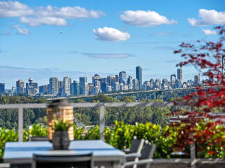 Experience breathtaking panoramic views of the city skyline and Lions Gate Bridge from this stunning property.